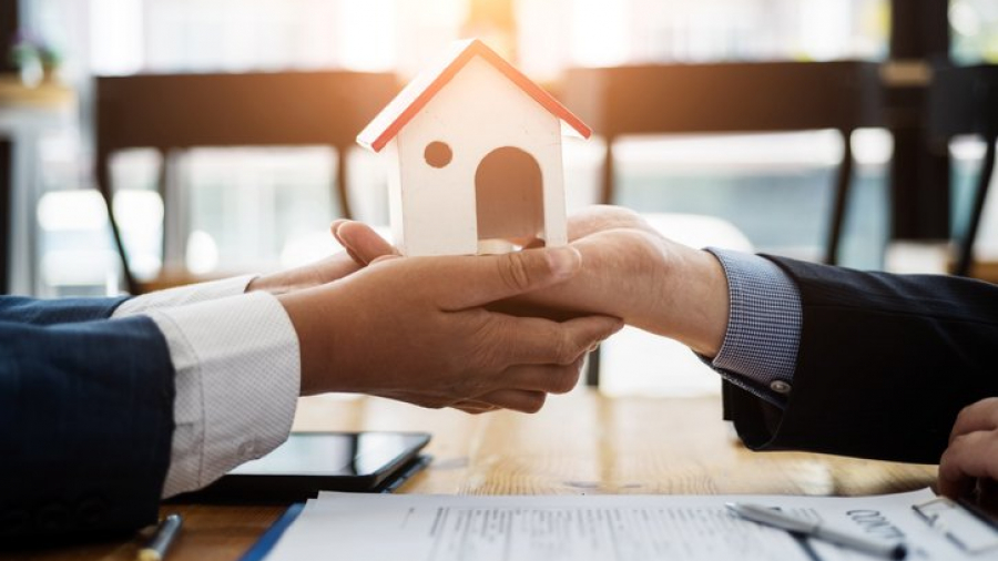 Estate planning attorney explaining joint tenancey before signing a contract housing estate in office. Joint tenancy concept.