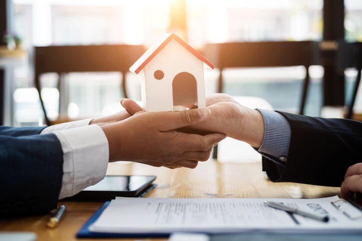 Estate planning attorney explaining joint tenancey before signing a contract housing estate in office. Joint tenancy concept.