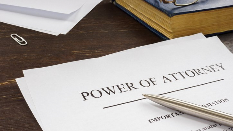 Power of attorney POA legal document and pen.
