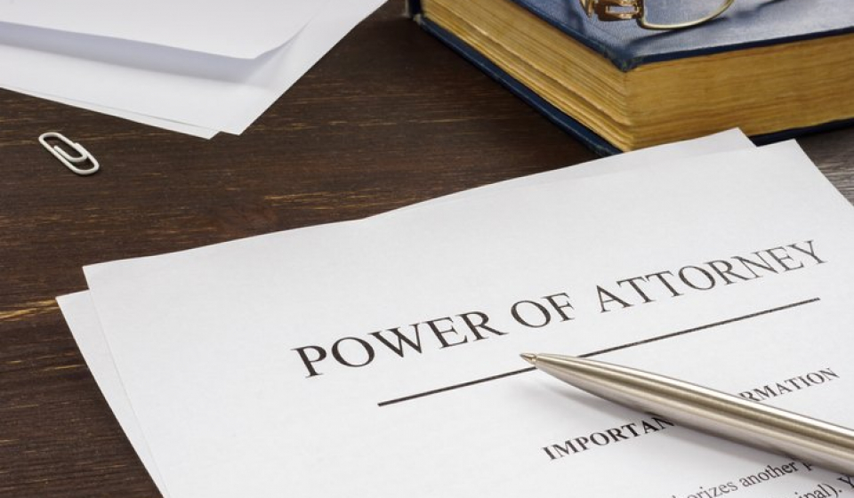 Power of attorney POA legal document and pen.