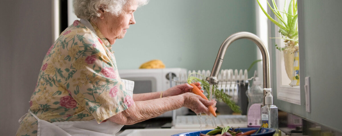 lady washing vegetables