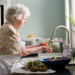 lady washing vegetables