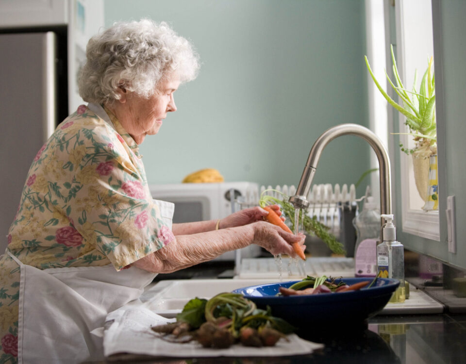 lady washing vegetables