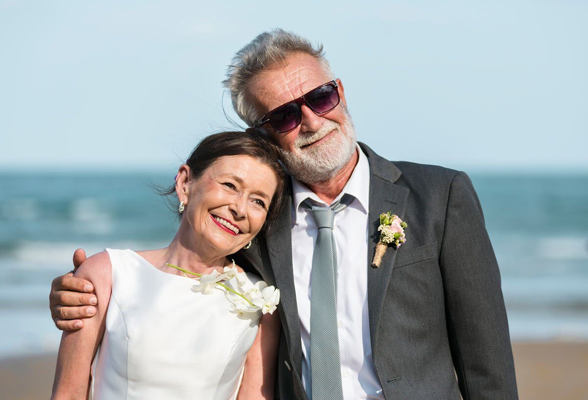 Senior couple getting married at the beach